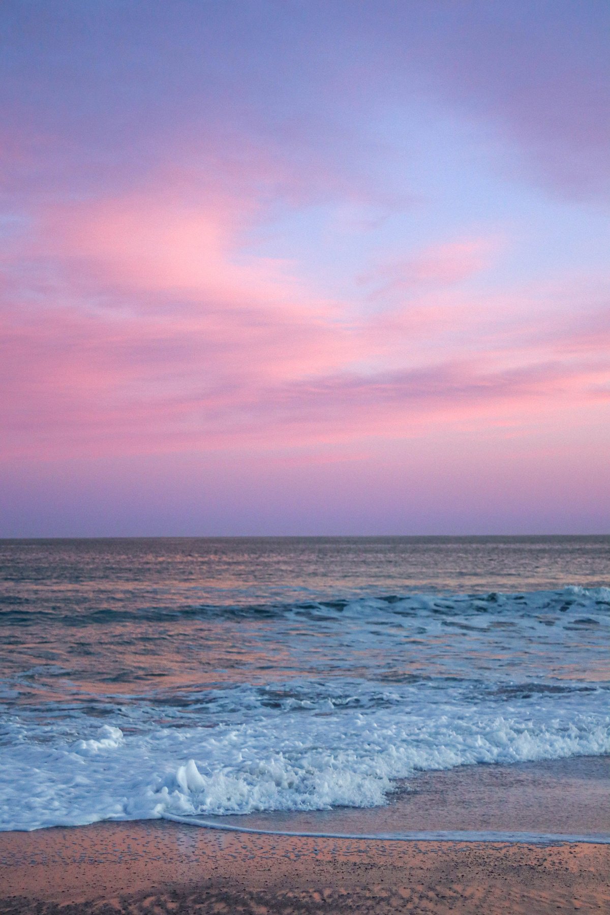 Ocean Waves Crashing on the Shore during Sunset